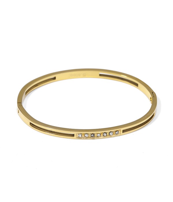 Pulsera rígida dorada con circonitas y ranuras