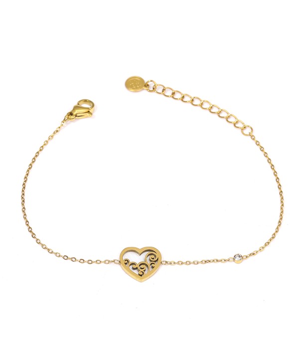 Pulsera dorada con corazón calado sobre nácar