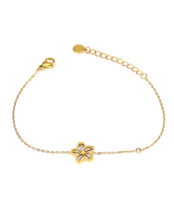 Pulsera dorada con flor calada y fondo de nácar