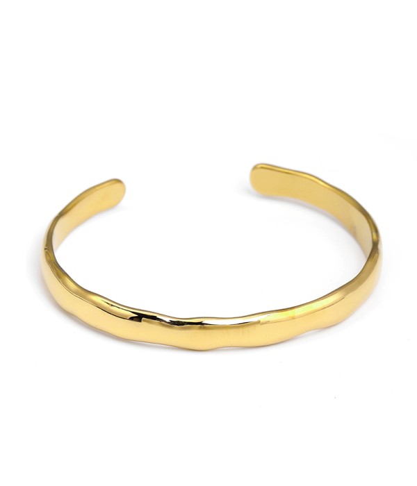 Pulsera rígida dorada con diseño ondulado