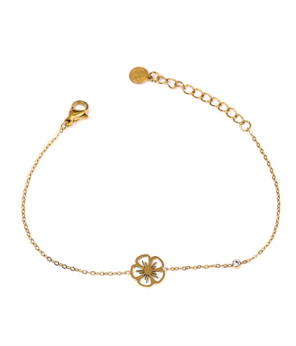 Pulsera dorada con flor y diseño minimalista
