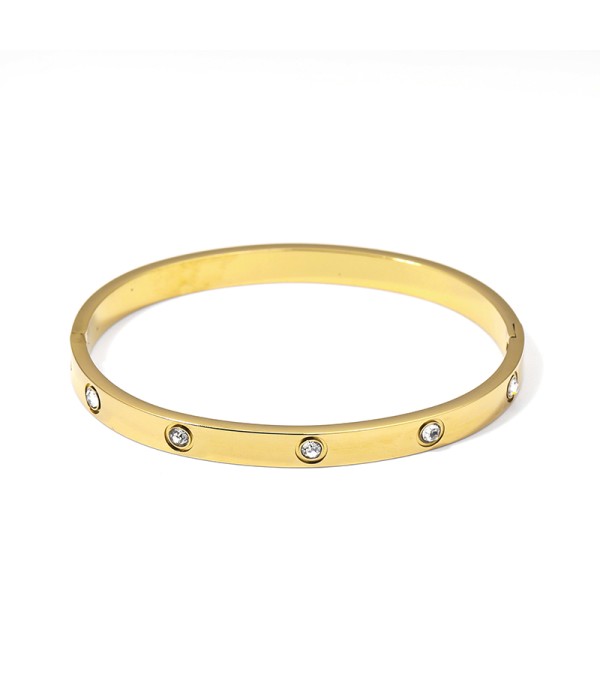 Pulsera rígida dorada con circonitas