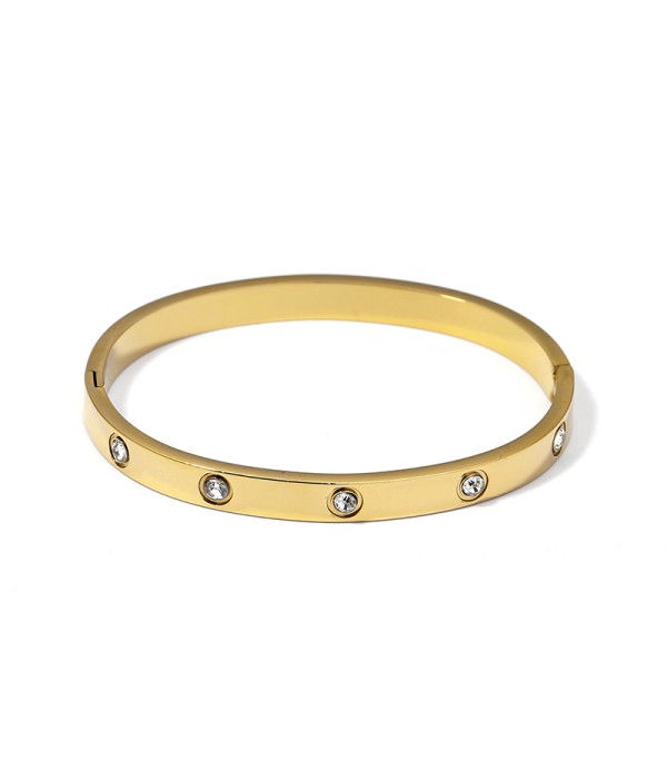 Pulsera rígida dorada con circonitas