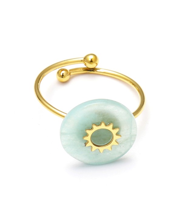 Anillo abierto dorado con detalle solar y...