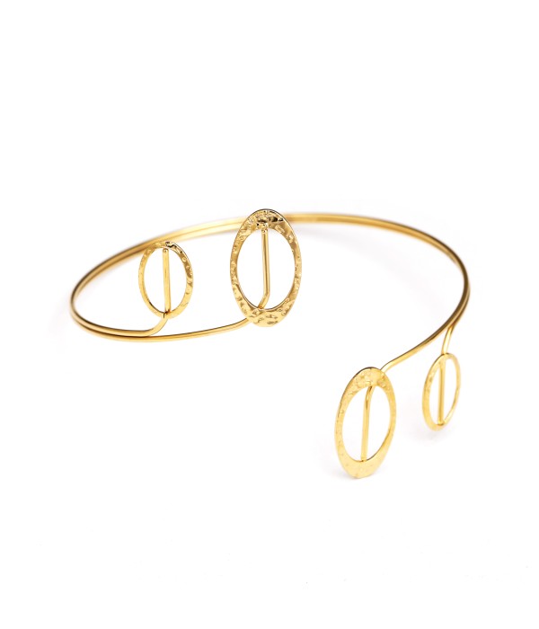 Brazalete de brazo dorado con elementos ovalados calados