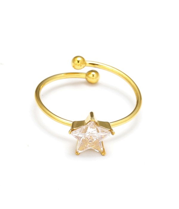 Anillo dorado con piedra cental corte estrella