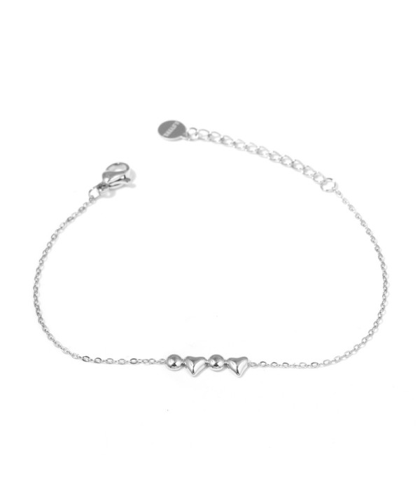 Pulsera plateada con corazones y círculos