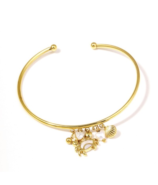 Pulsera rígida dorada con colgantes marinos y...