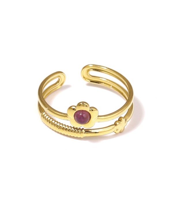 Anillo dorado con flor y piedra