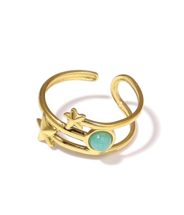 Anillo dorado con estrellas y piedra