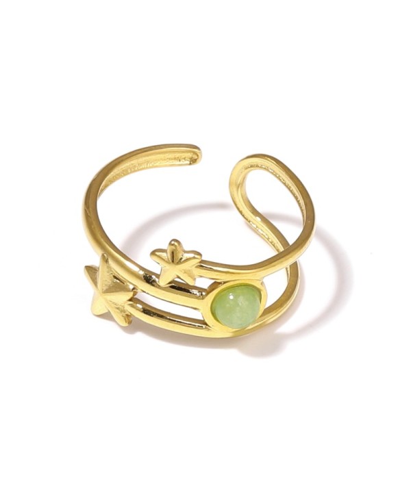 Anillo dorado con estrellas y piedra