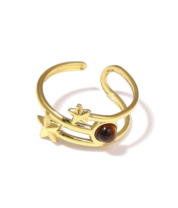 Anillo dorado con estrellas y piedra