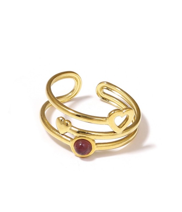 Anillo dorado con corazones y piedra