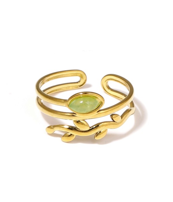 Anillo dorado con diseño de hojas y piedra