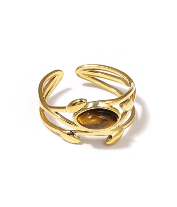 Anillo dorado de líneas entrelazadas con hojas y piedra