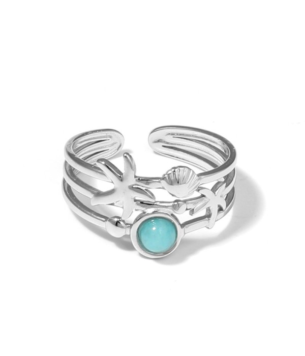 Anillo plateado con estrella de mar, concha y piedra