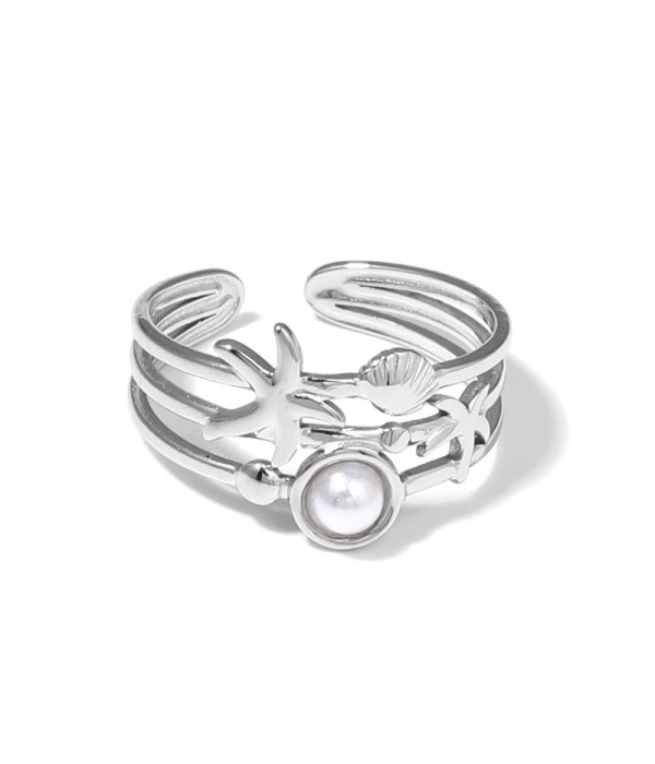 Anillo plateado con estrella de mar, concha y...