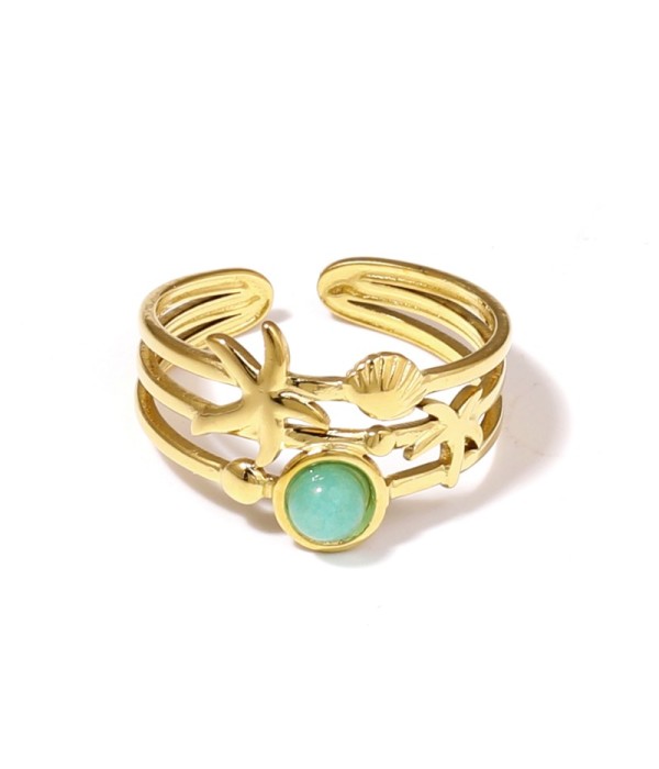 Anillo dorado con estrella de mar, concha y piedra