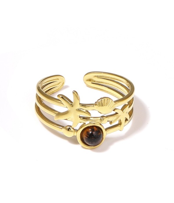 Anillo dorado con estrella de mar, concha y piedra