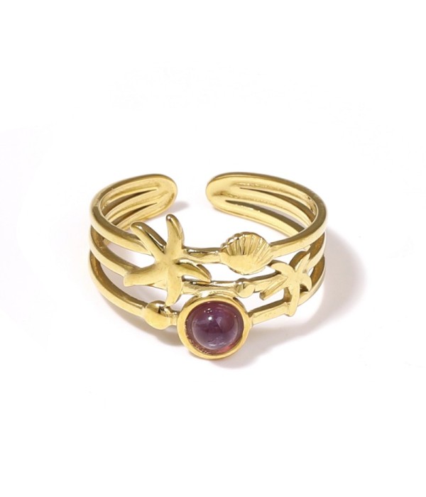 Anillo dorado con estrella de mar, concha y piedra
