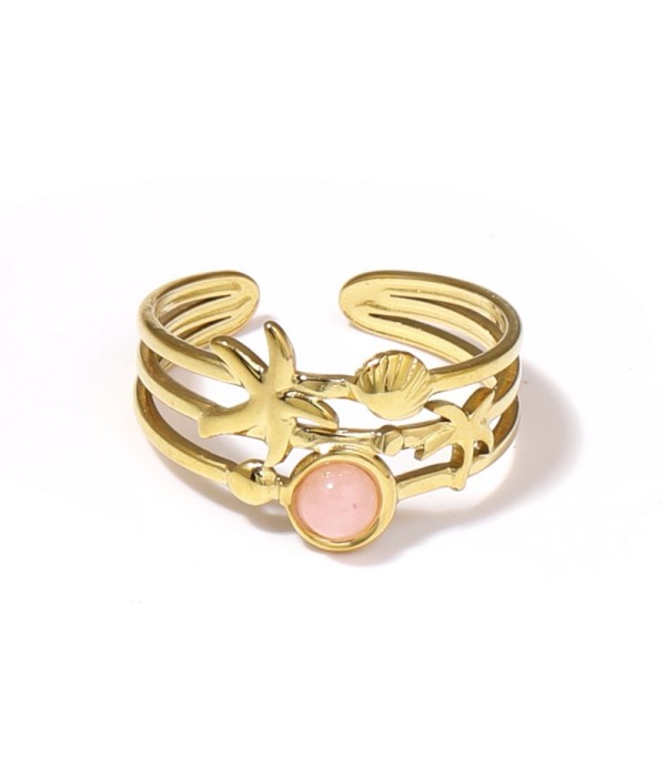 Anillo dorado con estrella de mar, concha y piedra