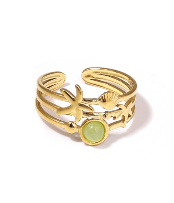 Anillo dorado con estrella de mar, concha y piedra