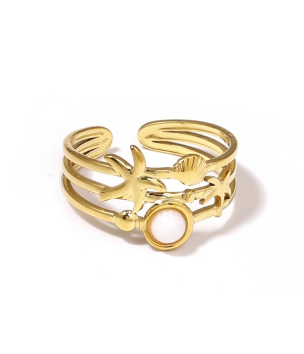 Anillo dorado con estrella de mar, concha y piedra