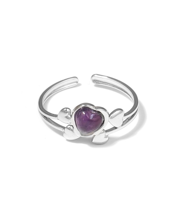 Anillo plateado con corazones y piedra