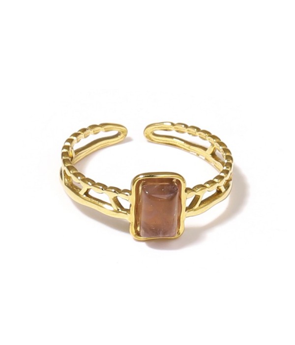 Anillo dorado con detalles calados y piedra...