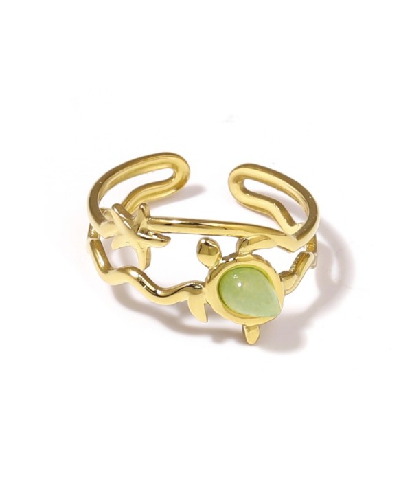 Anillo dorado con motivos marinos y piedra