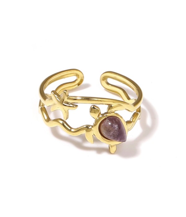 Anillo dorado con motivos marinos y piedra