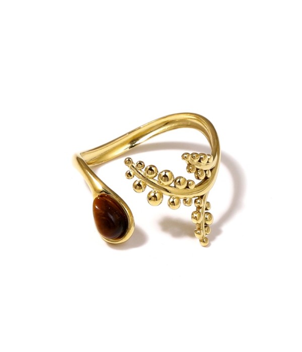 Anillo dorado con detalles botánicos y piedra