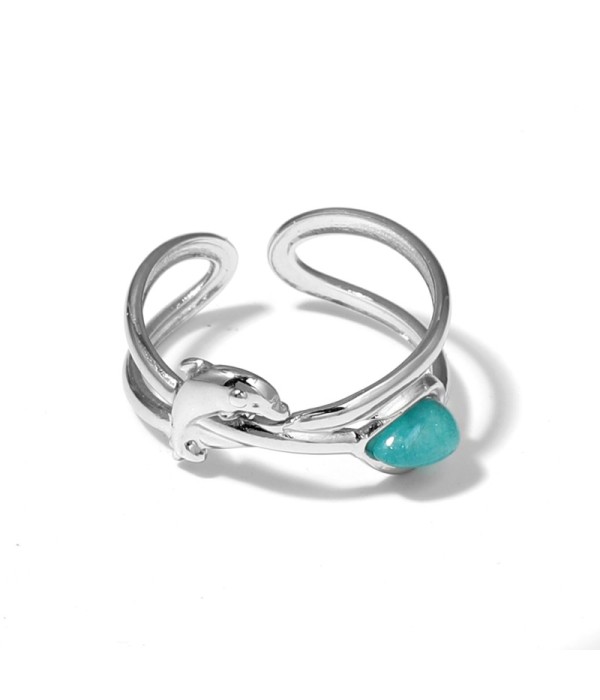 Anillo plateado con diseño de delfín y piedra
