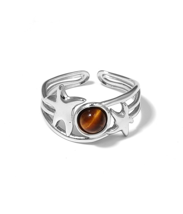 Anillo plateado con estrellas de mar y piedra