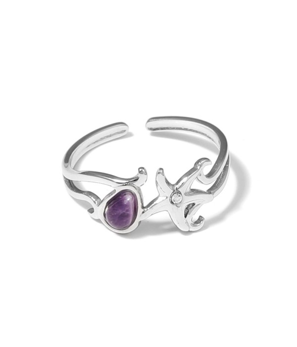 Anillo plateado con estrella de mar y piedra