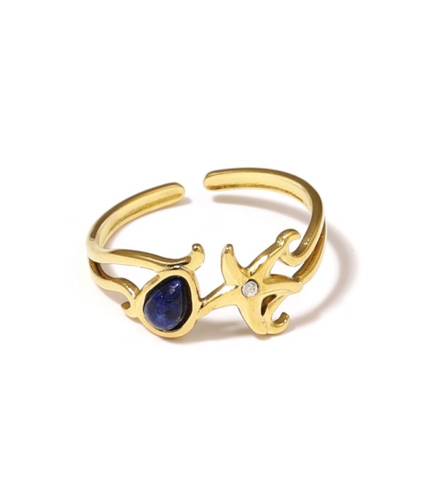 Anillo dorado con estrella de mar y piedra