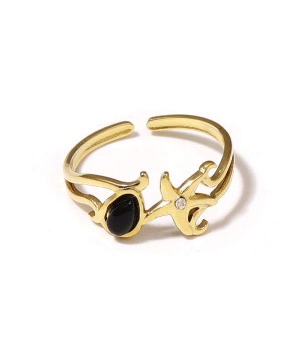 Anillo dorado con estrella de mar y piedra
