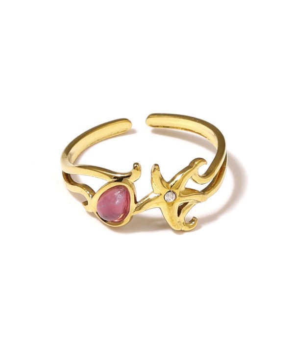 Anillo dorado con estrella de mar y piedra 2