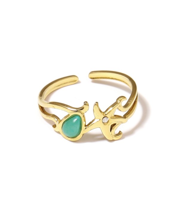 Anillo dorado con estrella de mar y piedra