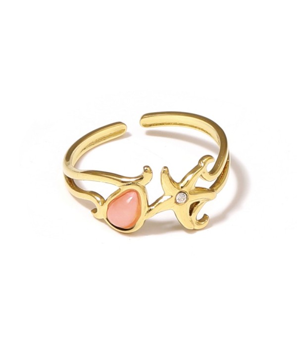 Anillo dorado con estrella de mar y piedra
