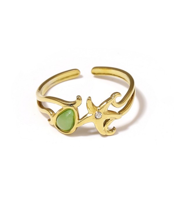 Anillo dorado con estrella de mar y piedra