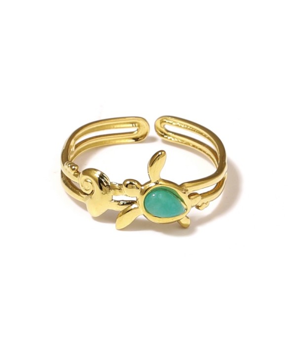 Anillo dorado con motivos marinos y piedra