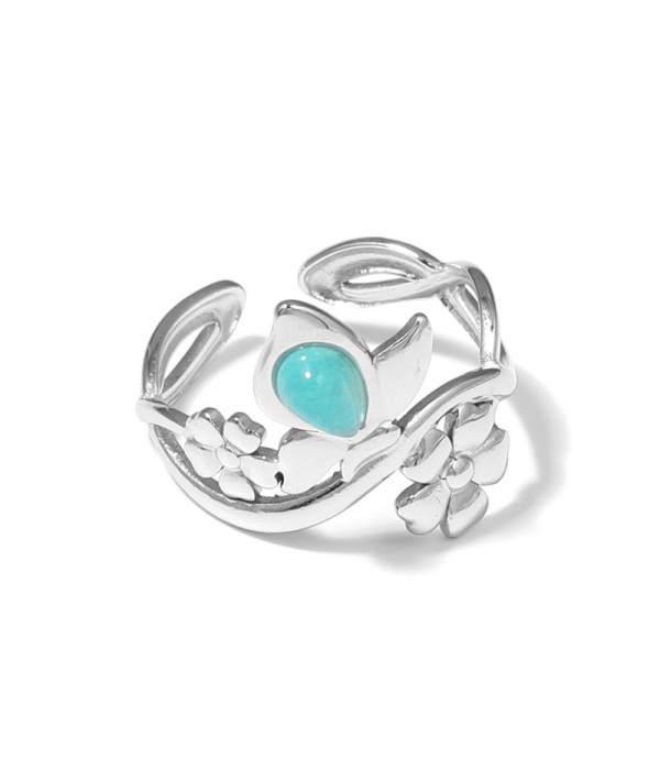 Anillo plateado con motivos flores y piedra