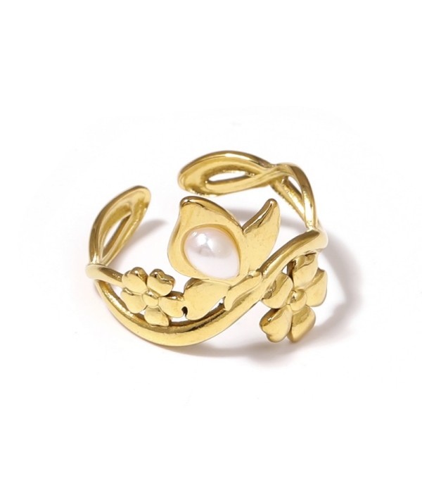 Anillo dorado con motivos flores y piedra