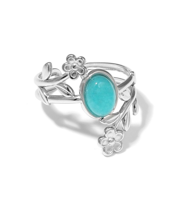 Anillo plateado con detalles botánicos y piedra
