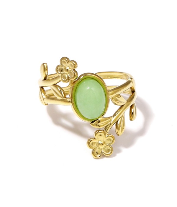 Anillo dorado con detalles botánicos y piedra