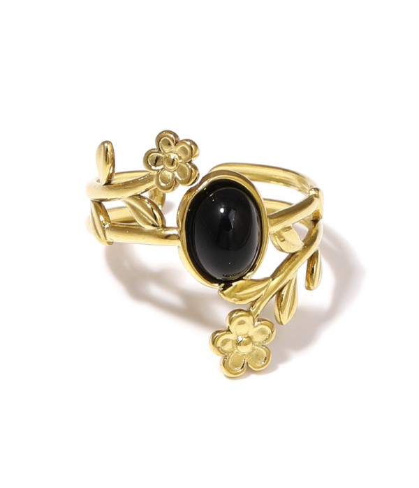 Anillo dorado con detalles botánicos y piedra