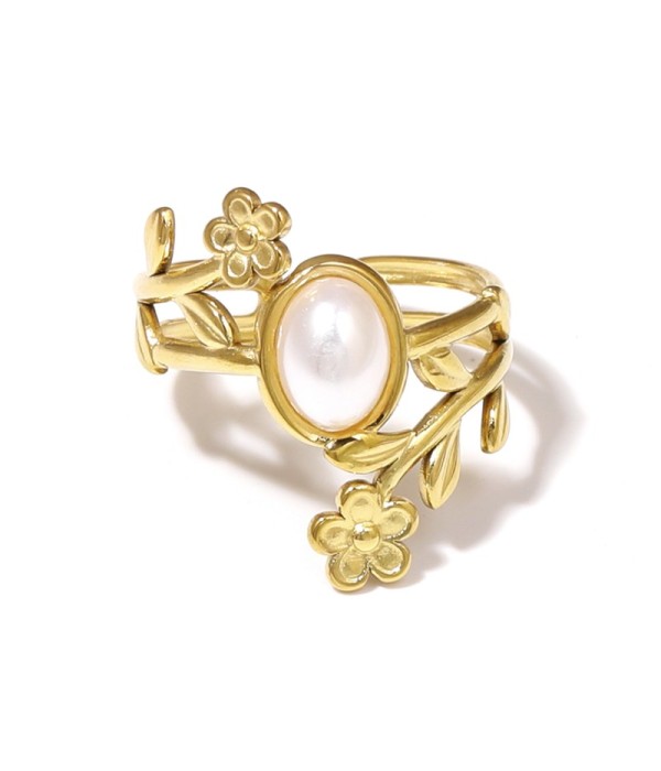 Anillo dorado con detalles botánicos y piedra 2