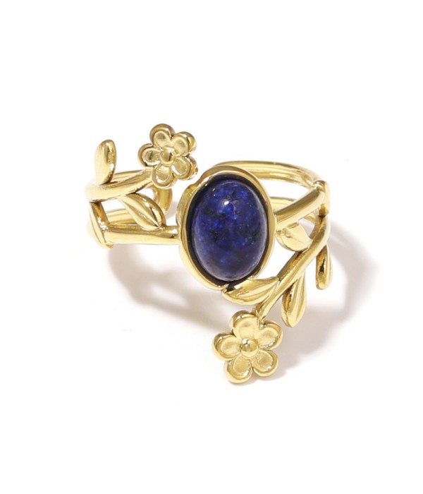 Anillo dorado con detalles botánicos y piedra