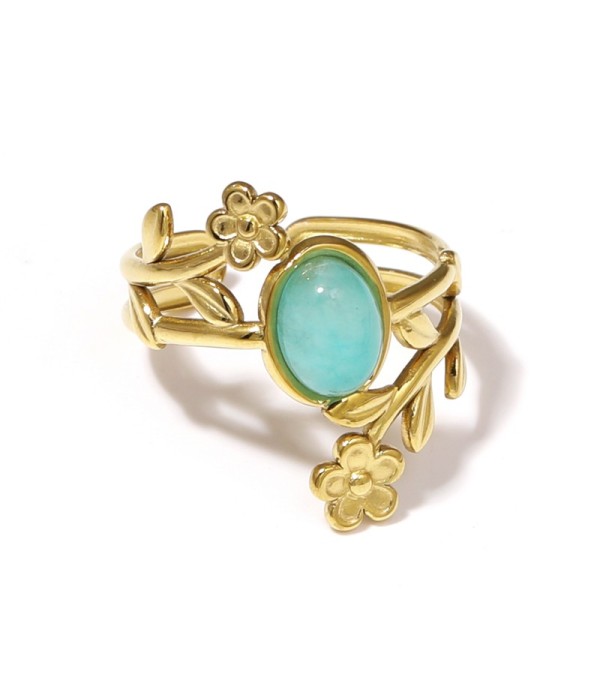 Anillo dorado con detalles botánicos y piedra